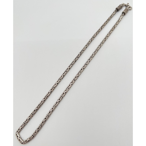 1150 - A 17 inch byzantine style silver chain neckalace with hook and eye clasp. Silver marks to clasp. Tot... 