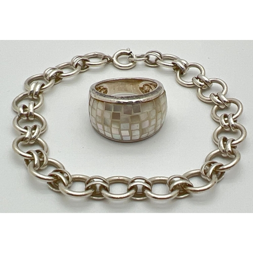 1159 - 2 silver jewellery items. An alternating oval and round cut link bracelet with spring clasp and a ba... 