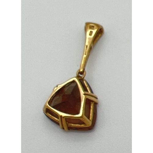 1161 - A 9ct gold drop style pendant set with a trillion cut smoked quartz and 3 small round cut diamonds t... 