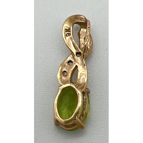 1166 - A 9ct gold pendant with twist design bale set with an oval cut peridot and 5 small round cut white s... 