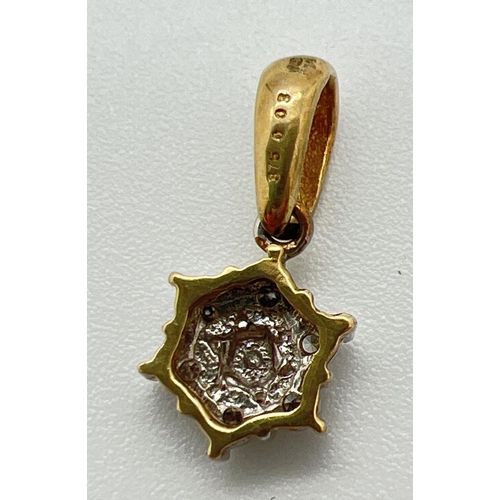 1171 - A 9ct gold drop style flower shaped pendant set with 7 small round cut diamonds. Gold marks to back ... 