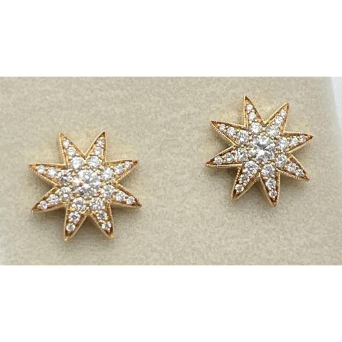 1175 - A pair of 18ct yellow gold diamond set star shaped stud earrings by Luke Stockley, London. Each earr... 