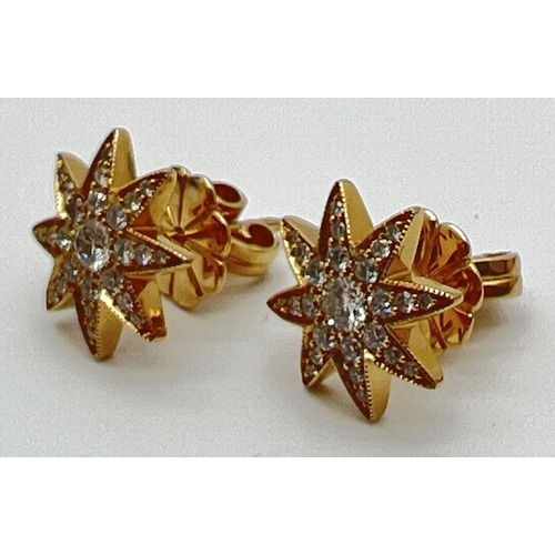 1175 - A pair of 18ct yellow gold diamond set star shaped stud earrings by Luke Stockley, London. Each earr... 