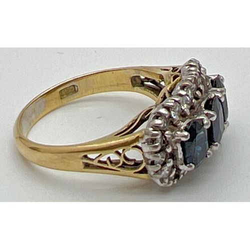 1177 - A 18ct gold sapphire and diamond trilogy dress ring. 3 central oval cut sapphires surrounded by 22 s... 