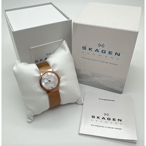 1191 - A boxed ladies Skagen 233XSRR wristwatch. Gold tone mesh bracelet strap and case with mother of pear... 