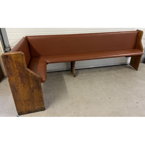 1392 - A corner bench seat as taken from a local pub, originally made from antique pews. Covered in tan col... 