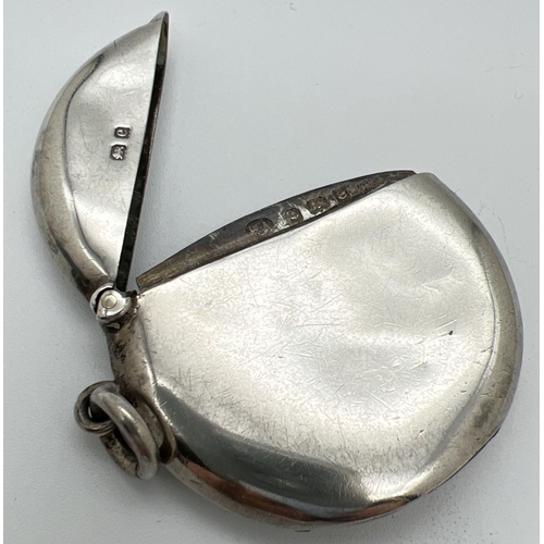 1209 - An Edwardian silver circular shaped vesta case with side hanging bale. Fully hallmarked to inside ri... 