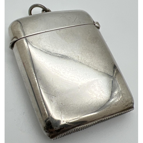 1210 - A large sized Edwardian silver vesta case with hinged lid and engraved name to front. Fully hallmark... 