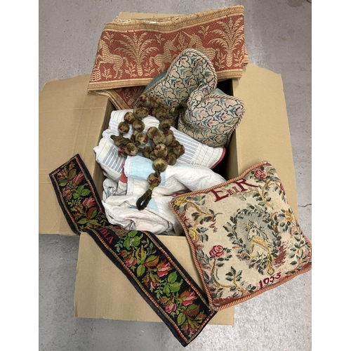 1349 - A large box of vintage textiles. To include tapestry panels, pom-pom tie backs, tapestry fronted cus... 