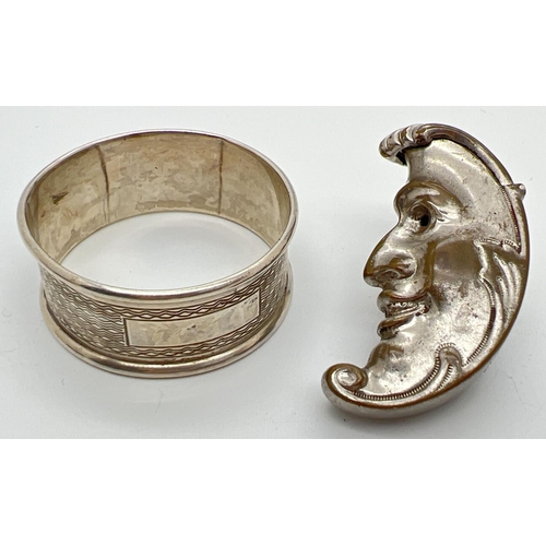 1211 - A novelty silver plated vesta case together with a silver napkin ring. Crescent moon shaped vesta, w... 