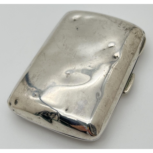 1212 - A Victorian silver curve backed cigarette case with gilt lined interior. Hinge in good order and sna... 