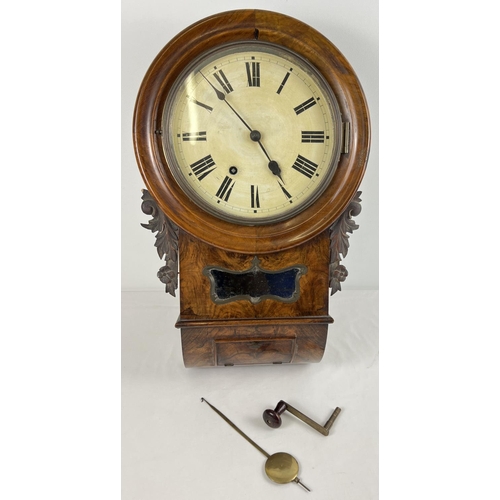 1266 - A walnut veneer wooden cased antique wall hanging clock with striking bell to top. Carved floral det... 