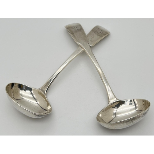 1215 - A pair of William Bateman Georgian silver ladles with engraved initial to handles. Hallmarked to rev... 