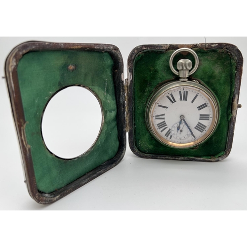 1218 - A late Victorian silver covered pocket watch stand with an Argentan Goliath pocket watch. Silver fro... 