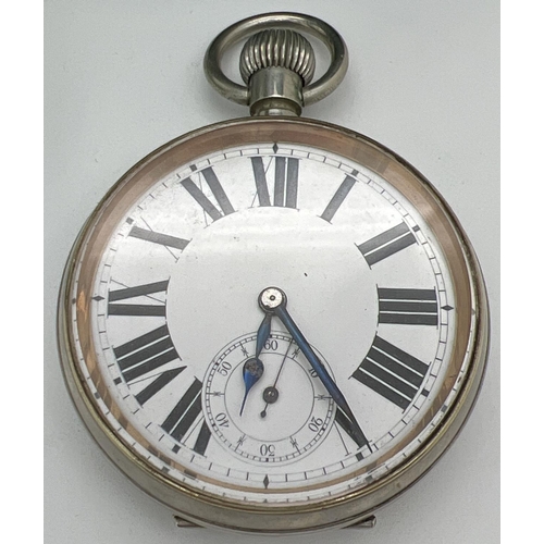 1218 - A late Victorian silver covered pocket watch stand with an Argentan Goliath pocket watch. Silver fro... 