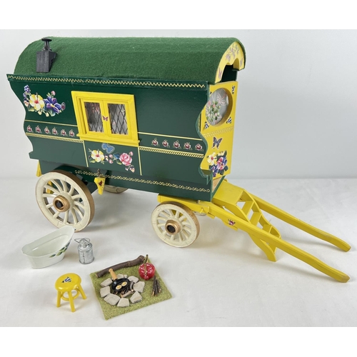 1355 - A painted wooden model of a Gypsy caravan with hand painted and sticker detail and green felt roof. ... 