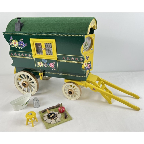 1355 - A painted wooden model of a Gypsy caravan with hand painted and sticker detail and green felt roof. ... 