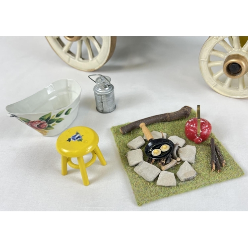 1355 - A painted wooden model of a Gypsy caravan with hand painted and sticker detail and green felt roof. ... 