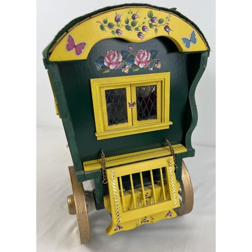 1355 - A painted wooden model of a Gypsy caravan with hand painted and sticker detail and green felt roof. ... 