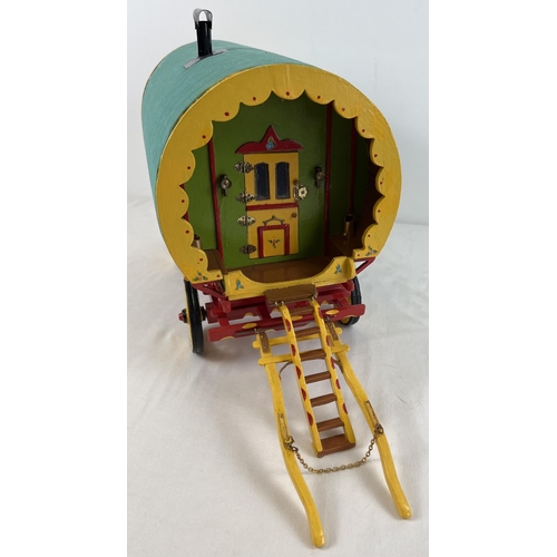 1356 - A painted wooden dome topped model of a Gypsy caravan with hand painted and sticker detail. Green fa... 