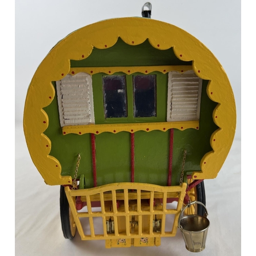 1356 - A painted wooden dome topped model of a Gypsy caravan with hand painted and sticker detail. Green fa... 