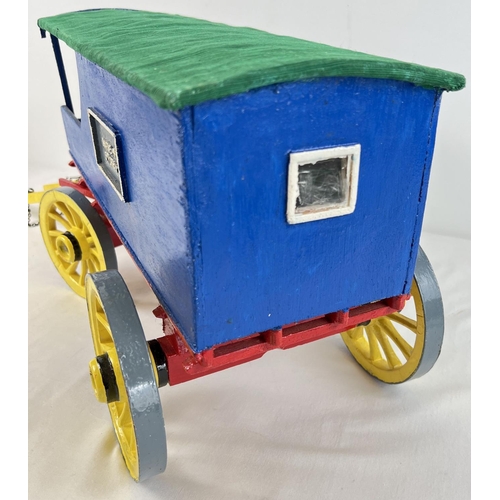 1357 - A painted wooden model caravan of Harveys Stores with green fabric roof. Together with metal accesso... 