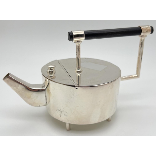 1220 - A modern silver plated replica of a Christopher Dresser style teapot of Art Deco design. Tubular for... 