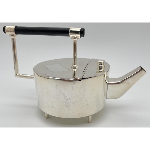 1220 - A modern silver plated replica of a Christopher Dresser style teapot of Art Deco design. Tubular for... 