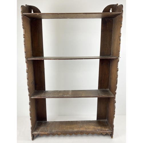 1395 - A vintage stained pine wall hanging shelf/bookcase with shaped end panels and 4 shelves. Approx. 91 ... 