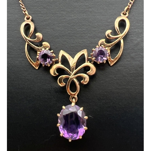 2 - A 9ct gold and amethyst fixed pendant necklace. A 3 sectional pendant set with 3 large amethyst ston... 