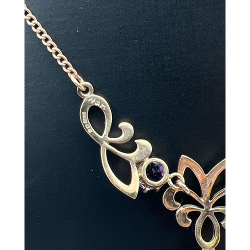 2 - A 9ct gold and amethyst fixed pendant necklace. A 3 sectional pendant set with 3 large amethyst ston... 