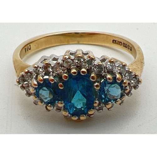 9 - A 9ct gold, London blue topaz and diamond ring in a diamond shaped halo setting. Central oval cut Lo... 