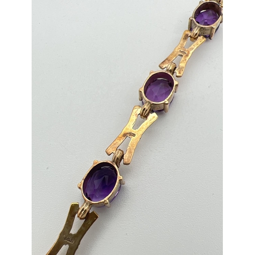 11 - A 9ct yellow gold and amethyst love and kisses style 13 link bracelet of alternating oval cut amethy... 