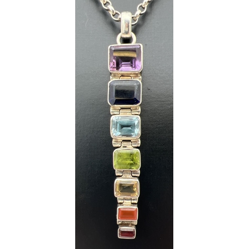 16 - A 925 silver and coloured semi precious stone pendant on a 16