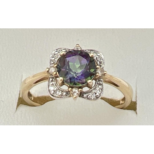 17 - A 9ct gold, mystic topaz and diamond ring in a square shaped basket style setting. Central round cut... 