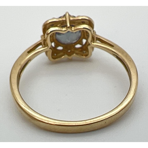 17 - A 9ct gold, mystic topaz and diamond ring in a square shaped basket style setting. Central round cut... 