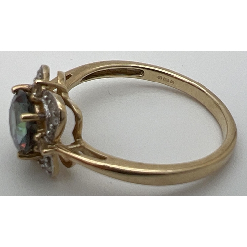 17 - A 9ct gold, mystic topaz and diamond ring in a square shaped basket style setting. Central round cut... 