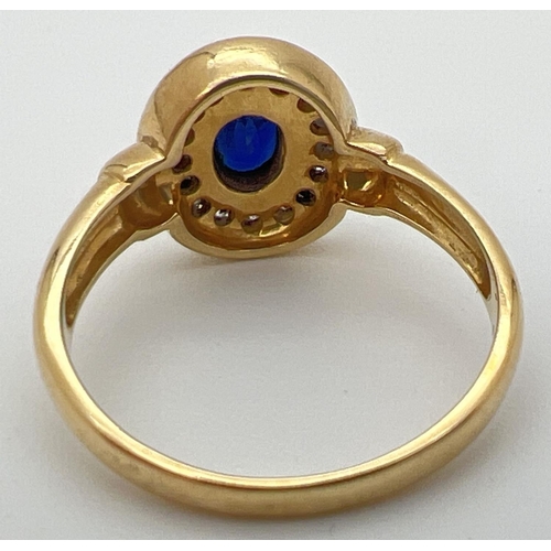 24 - An 18ct gold, sapphire and diamond ring with central oval shaped bezel set sapphire (approx. 6mm x 4... 