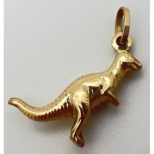 25 - A 10ct gold charm/pendant modelled as a dinosaur. Hanging bale stamped '417 Italy'. Approx. 2cm long... 