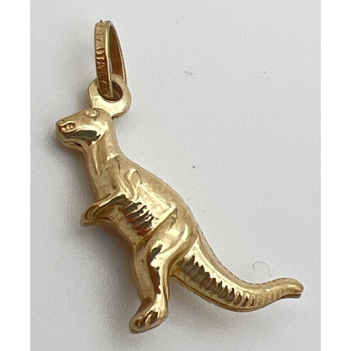 25 - A 10ct gold charm/pendant modelled as a dinosaur. Hanging bale stamped '417 Italy'. Approx. 2cm long... 