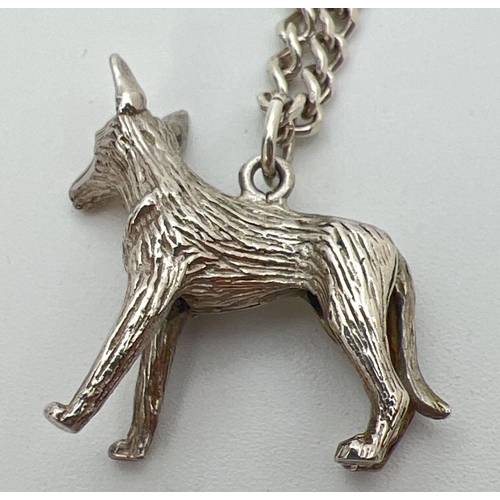 26 - A white metal pendant modelled as a dog an an 18