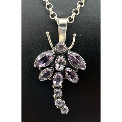 33 - An amethyst set pendant in the shape of a dragonfly on a 17