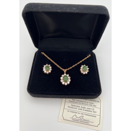 36 - An 18ct gold plated pendant necklace and matching earrings set with Jade & cubic Zirconias. In a flo... 