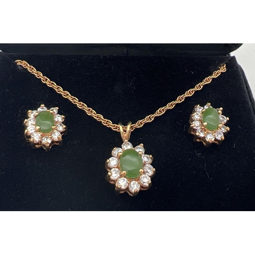 36 - An 18ct gold plated pendant necklace and matching earrings set with Jade & cubic Zirconias. In a flo... 