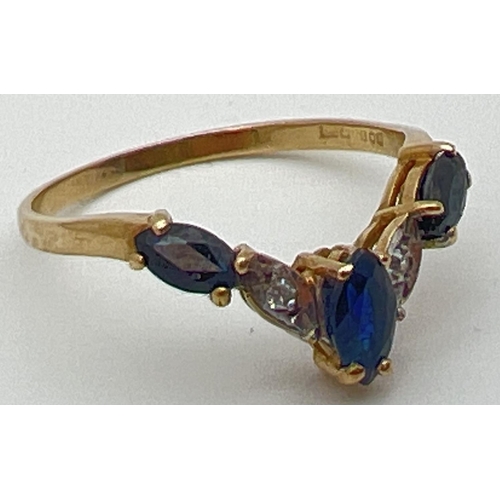 39 - A 9ct gold wishbone ring with 3 marquise cut sapphires and 2 illusion set diamonds. Fully hallmarked... 