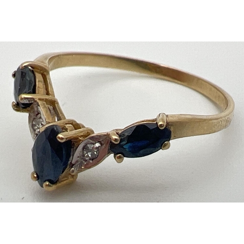 39 - A 9ct gold wishbone ring with 3 marquise cut sapphires and 2 illusion set diamonds. Fully hallmarked... 