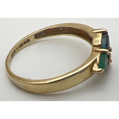 40 - A 9ct yellow gold multi stone trinity ring with a pear cut emerald, sapphire & ruby in a 3 point sta... 