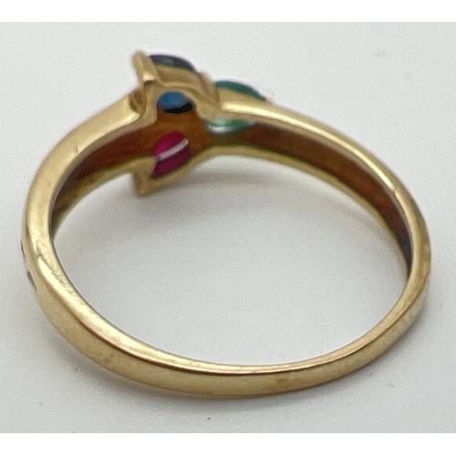 40 - A 9ct yellow gold multi stone trinity ring with a pear cut emerald, sapphire & ruby in a 3 point sta... 