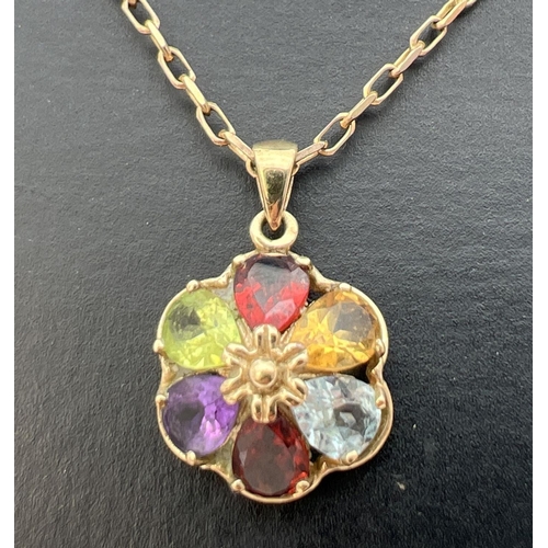 42 - A 9ct gold multi stone pendant on a 9ct gold 18