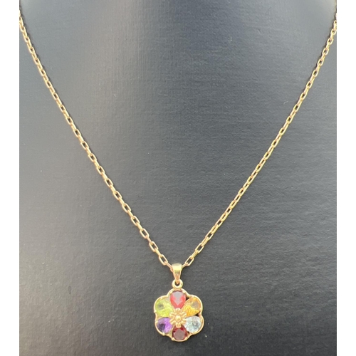 42 - A 9ct gold multi stone pendant on a 9ct gold 18